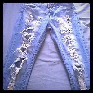Light colored skinny jeans with holes
